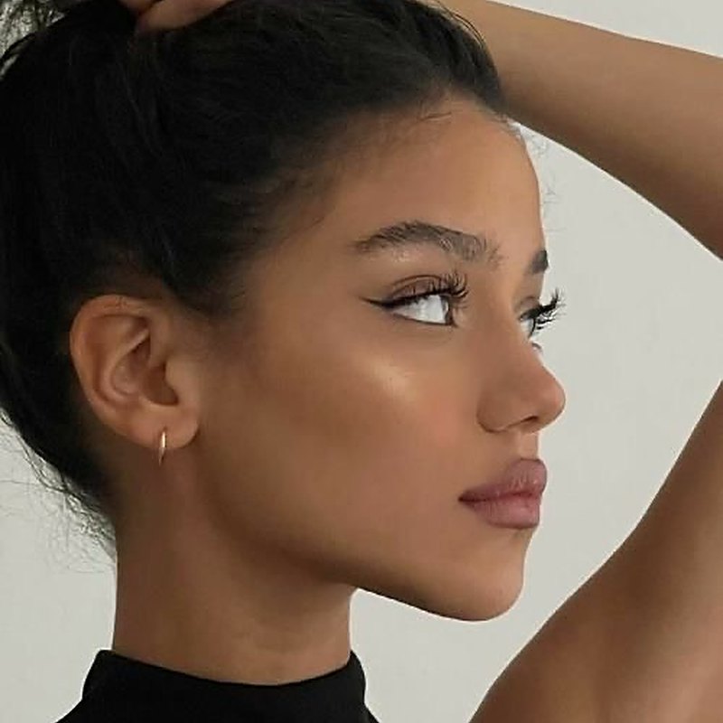 Side profile of a woman's face and jawline